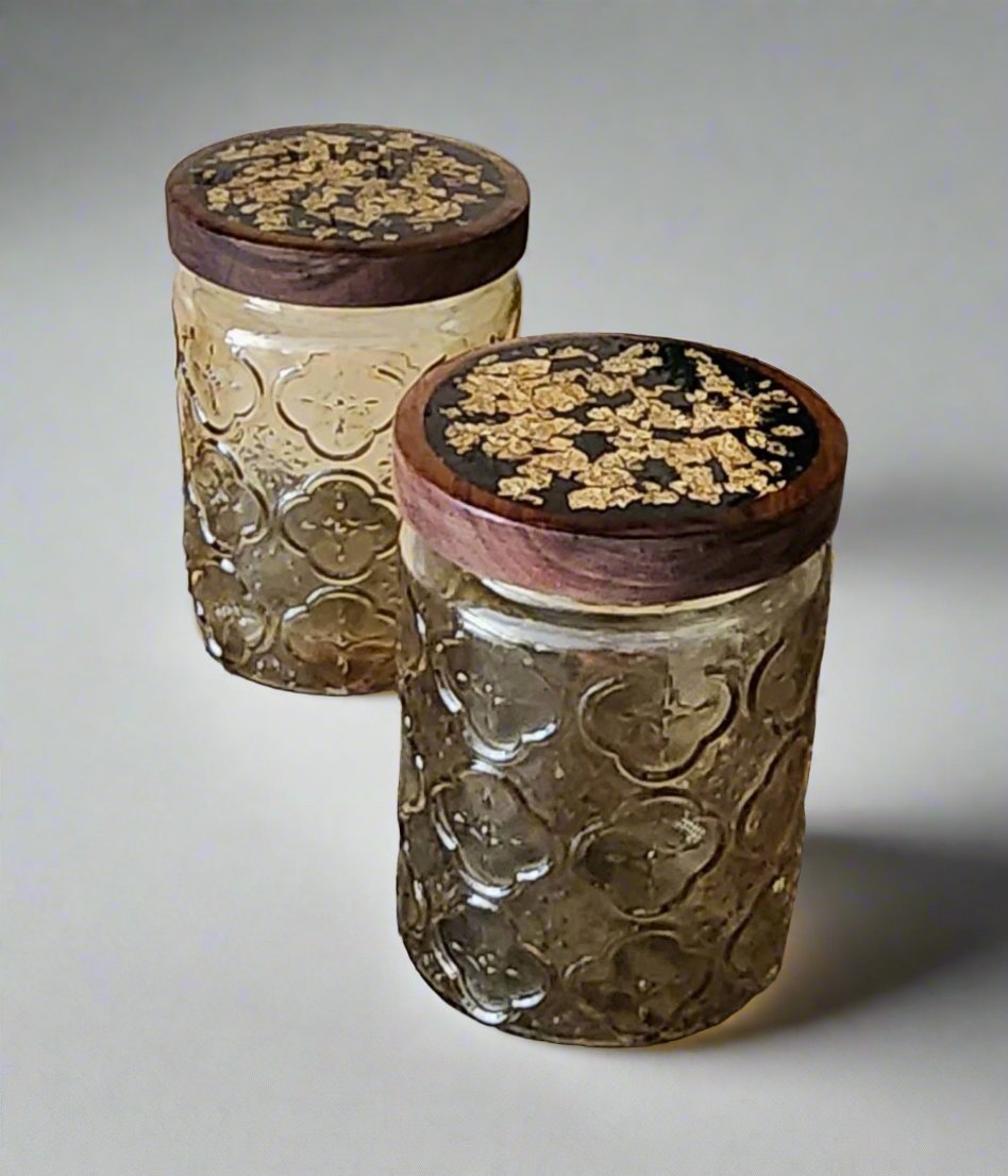 Gold set of jars with decorated lids